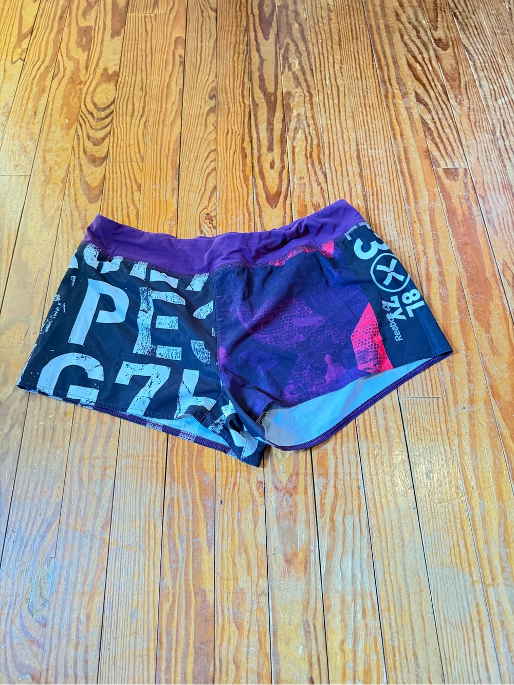 Reebok Women's Purple and Black Graphic Athletic Shorts